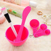 4 in 1 Mask Bowl and Brush Set featuring a pink bowl, brush, and measuring spoons for skincare routines.