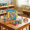 90-Piece Creative Suction Building Set on a table with colorful pieces and a vibrant box in a playful room setting.