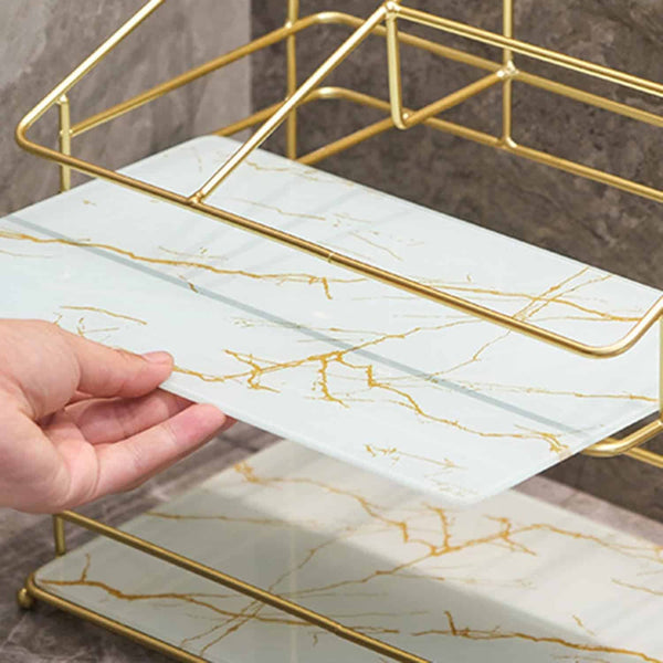 Image of a hand adjusting a shelf on the 2-Tier Space-Saving Bathroom Rack with a gold-finished frame.