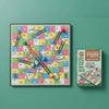 Mini Magnetic Snakes & Ladders Board Game displayed with colorful board and packaging.
