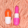 Capsule-Shaped Writing Pen displayed on fluffy pink background, showcasing playful capsule design and vibrant colors.