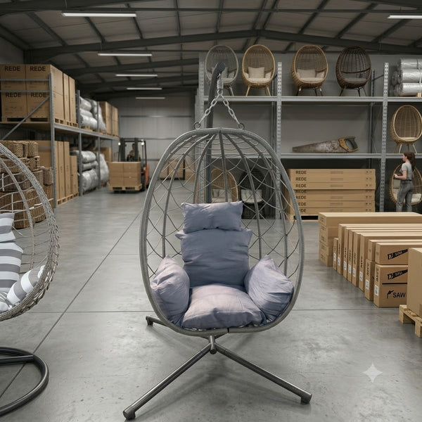 Indoor Outdoor Swing Egg Chair hanging in a spacious interior with decorative cushions for relaxation.