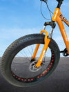 26'' Large Frame Black Fat Tire Bicycle front tire showcasing its oversized fat tread for stability on various terrains.