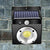 COB Solar Wall Light mounted on a stone wall, featuring a solar panel and LED illumination.