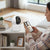 Smart Wireless Wi-Fi Indoor Security Camera monitoring home activities with mobile connectivity.