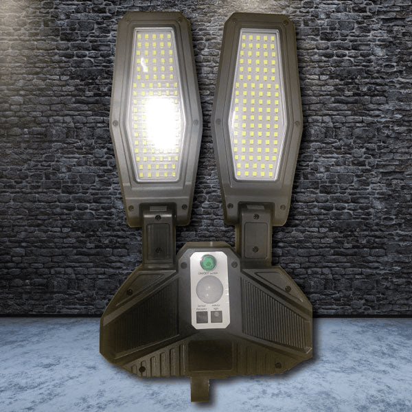 Solar Motion Wall Light - Energy Efficient Outdoor Security with dual LED panels for enhanced visibility at night.