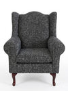 Serena Grey Fabric Wingback Chair featuring a structured design and comfortable seating.