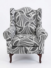 Serena Grey Fabric Wingback Chair with modern black and white pattern and sturdy wooden legs.