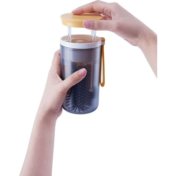 6 in 1 Baby Bottle Cleaning Kit Travel Set with hands holding the bottle cleaning tool.