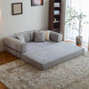 Modern Space-Saving Convertible Sofa Bed styled in a cozy living room with decorative pillows and a rug.