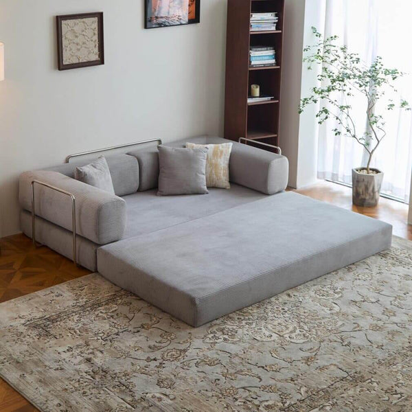 Modern Space-Saving Convertible Sofa Bed styled in a cozy living room with decorative pillows and a rug.