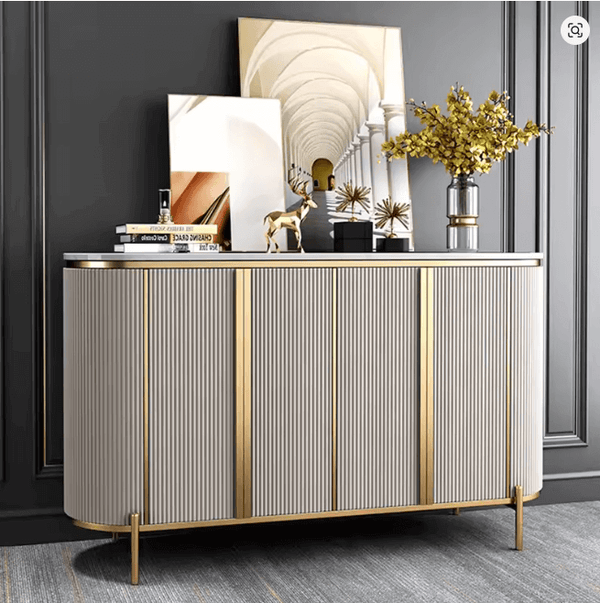 Modern Luxury Sideboard Table featuring a marble-effect top, fluted doors, and gold accents in an elegant setting.