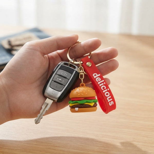 Snack Pop 3D Fast-Food Keychain featuring a burger design attached to a keychain with keys in hand.