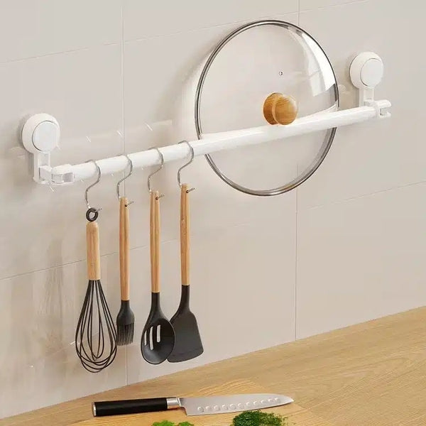 Multi-Functional Punch-Free Wall-Mounted Storage Rack with kitchen utensils and lid holder.