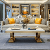 Grand Marble Coffee Table displayed in an elegant living room with a stylish sofa and decorative elements.