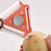 3 in 1 Peeler with Potato Eye Remover is used to remove eyes from a potato in a kitchen setting.