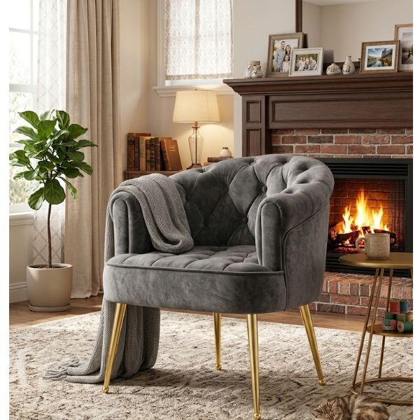 Luxury Tufted Velvet Barrel Dining Chair in cozy living room setting with warm fireplace.