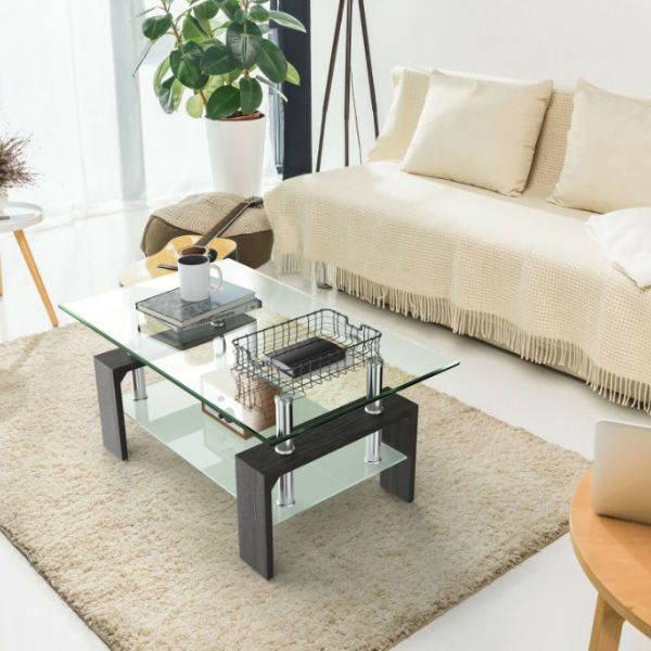 Modern 2 Tier Glass Coffee Table in a stylish living room with a cozy sofa and plant decor.