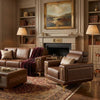 Luxury Quilted Accent Armchair with Wooden Legs in an elegant living room setting with a cozy fireplace.