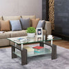 Modern 2 Tier Glass Coffee Table with a glass top and wooden base in a stylish living room setting.
