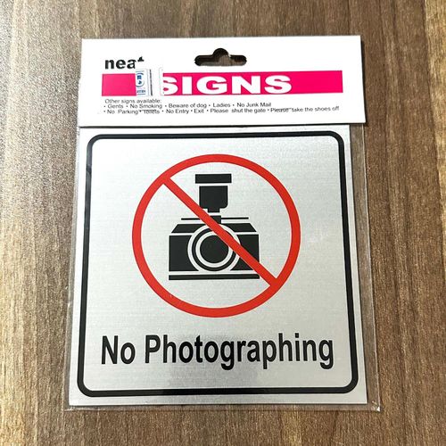 Image of a No Photographing Warning Sign displaying a camera crossed out in red.