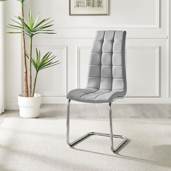 Enzo Faux Leather C Frame Dining Chair featuring a modern cantilever design with quilted upholstery in a stylish setting.