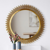 Sunburst Decorative Round Wall Mirror with a gold sunburst design reflecting light and framed with stylish accents.