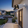 3MP 4-Channel NVR PoE Security Camera Kit mounted outside a home with warm light for enhanced security.