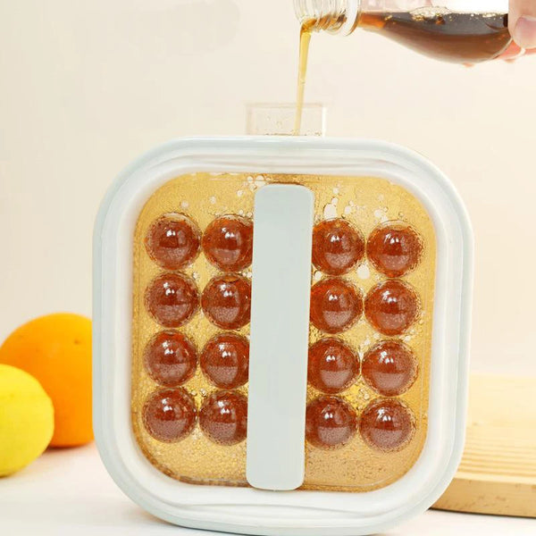 2-in-1 Ice Ball Maker Bottle with Lid being filled with liquid for ice ball freezing.