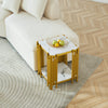 2 Tier Faux Marble Side Table with yellow legs and fruit bowl on top, placed next to a cream sofa.