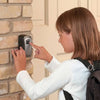 Child using Wall Mounted Aluminium Key Lock Box to access keys securely on a brick wall.
