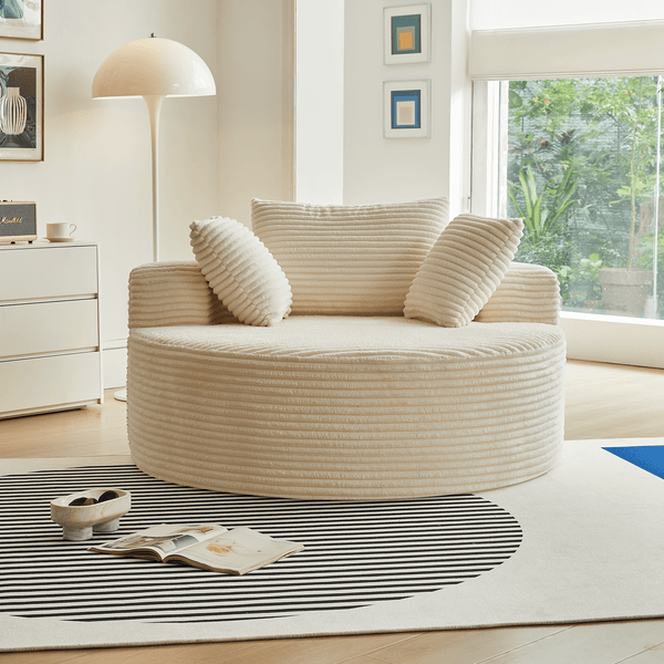 Round Corduroy Lounge Chair for Cozy Spaces in a modern living room setting with decorative pillows.