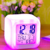 Color Change Digital Alarm Clock with LED display showing time and date, in vibrant colors on a bedside table.