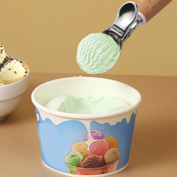 Stainless Steel Fruit & Dessert Scoop lifting mint ice cream from a colorful ice cream cup.