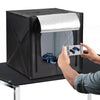 Person taking a photo of a model car inside a 60x60cm LED Deep Professional Photography Studio Light Box.