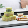 3-Piece Food Storage Container Set with fresh fruits and vegetables on a kitchen counter.