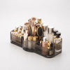 Multi-Compartment Cosmetic Desktop Storage Box filled with makeup brushes and skincare products in grey and gold design.