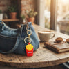 Snack Pop 3D Fast-Food Keychain featuring a playful French fries design attached to a denim bag.