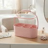 Portable Vanity Mirror Makeup Organizer Case in pink design with compartments for cosmetics on a wooden dresser.