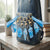 Blue Liquid Glitter Floating Charm Keychain and accessories attached to a denim backpack.