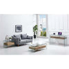 Vidal Side Table and glass coffee table in modern lounge with gray sofa and large windows.