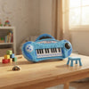 Blue 22-Key Battery-Operated Toy Keyboard Piano on a table surrounded by toys.