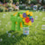 4-Head Bubble Gun Toy surrounded by bubbles, perfect for outdoor fun and interactive play.