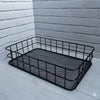 Metal Wire Grid Basket Organizer displayed against a white brick wall for stylish home organization.