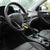 Car Steering Wheel Wire Rope Lock installed on a steering wheel for anti-theft security in a vehicle interior.