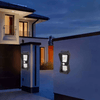 Solar Modern Outdoor Wall Light illuminating a modern home's exterior in the evening.