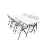 Summit Foldable Table with six white folding chairs, perfect for events and home use.