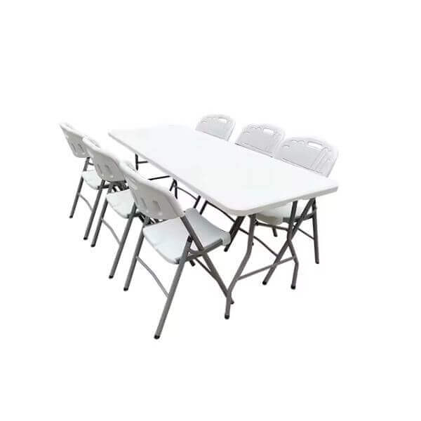 Summit Foldable Table with six white folding chairs, perfect for events and home use.