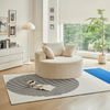 Round Corduroy Lounge Chair for Cozy Spaces in a modern living room setting with decorative pillows.