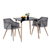 Compact Square Dining Table with two gray chairs and decorative fruit bowl on top, ideal for small dining spaces.